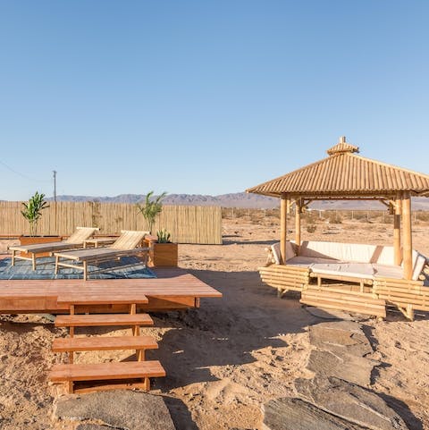 Absorb the California sunshine while admiring the desert from your daybed