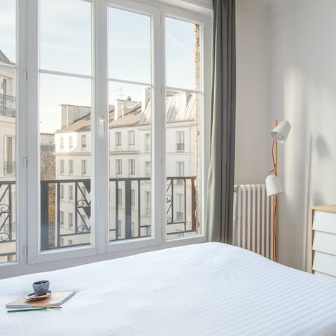Wake up to the sun shining and city views in the bright bedrooms