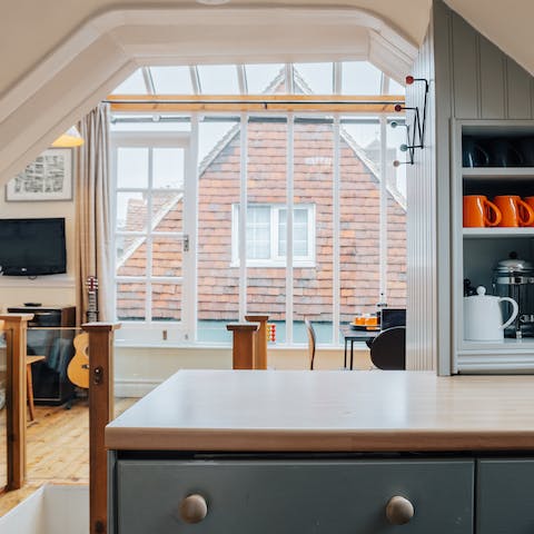 Make the most of abundant natural light that floods into the open-plan living and dining space on the top floor