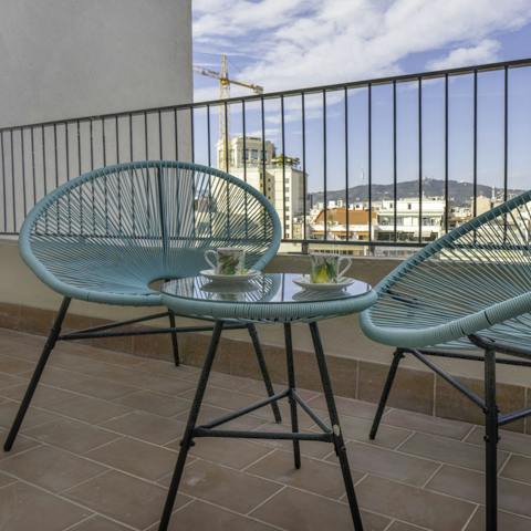 Enjoy coffee on the balcony with acapulco chairs