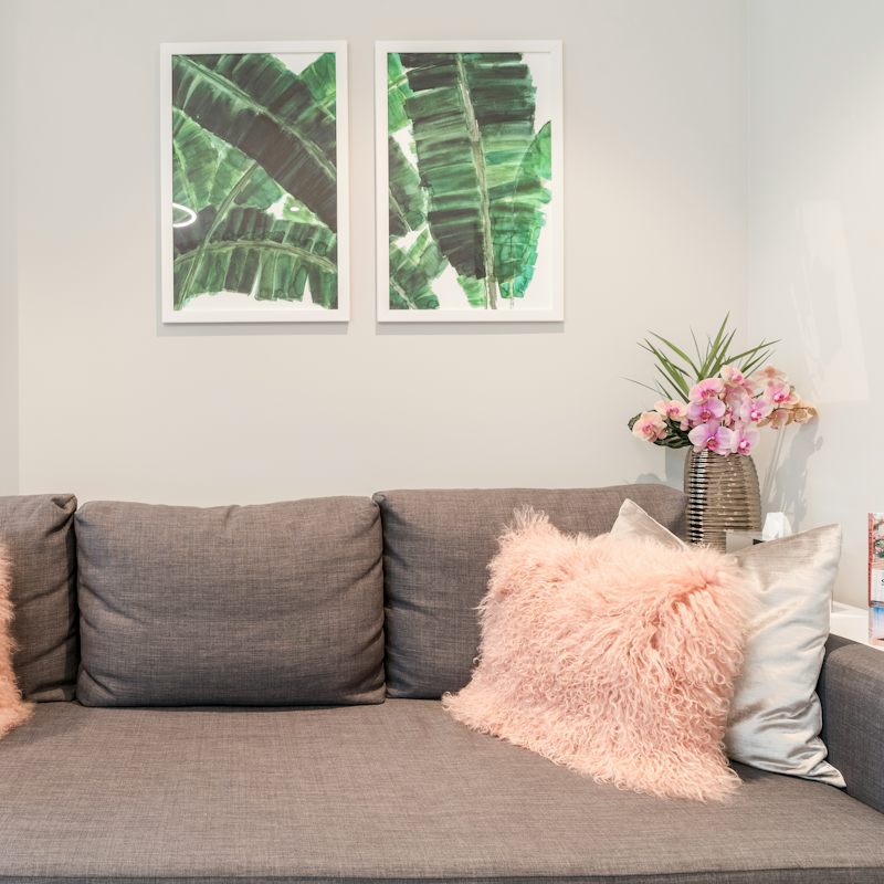 Feel at home with the comfy sofa and touches of colour and texture