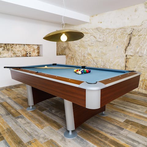 Escape the heat of the sun to play  a fun game of billiards