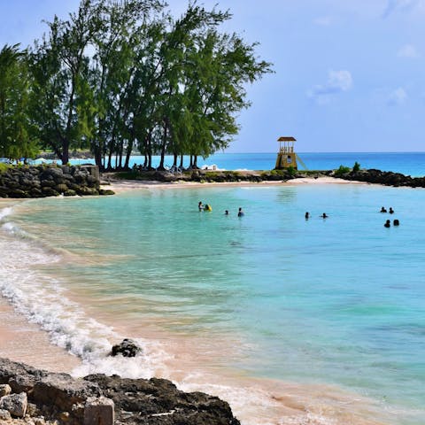 Soak up the Caribbean sunshine on an exclusive beach, a four-minute drive away