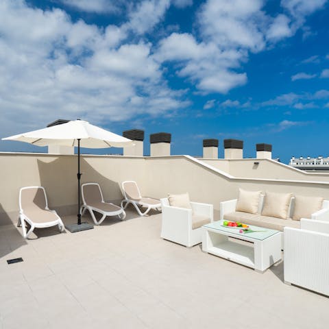 Head up to the apartment's rooftop terrace and watch the sun setting over the valley