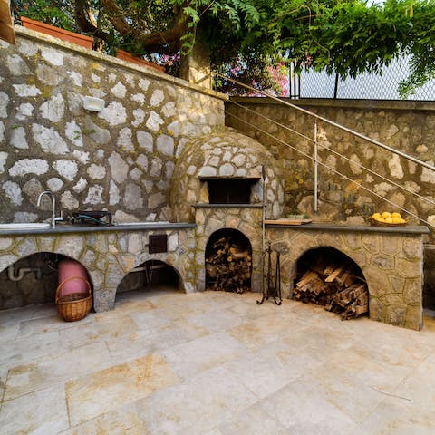 Fire up the stone oven to make homemade pizzas for lunch