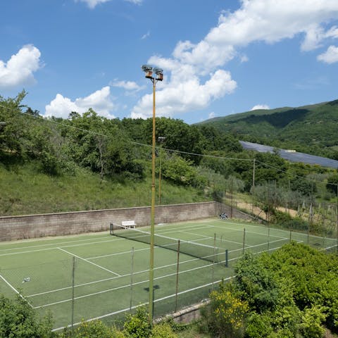 Enjoy a game of doubles on the shared tennis court