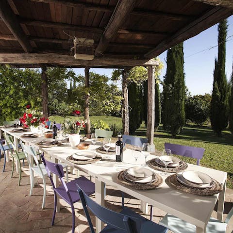 Dig into a professionally prepared meal in the shade of the terrace