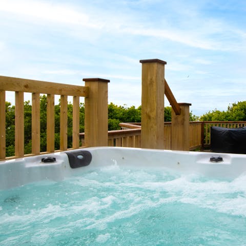 Sip wine in the bubbling eight person hot tub, relaxing and enjoying the scenery