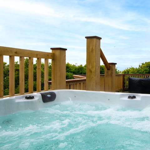Sip wine in the bubbling eight person hot tub, relaxing and enjoying the scenery