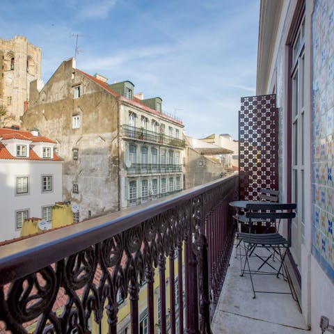 Relax with a glass out on the cosy balcony as the hum of Lisbon life goes on around you 