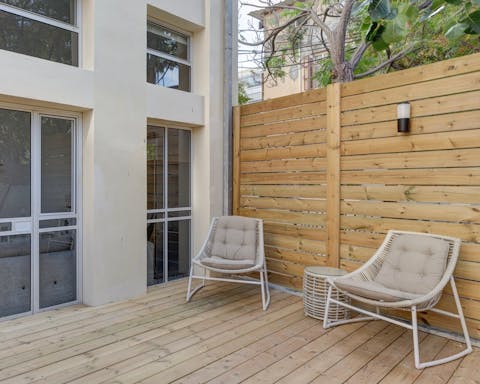 A patio with lounge furniture