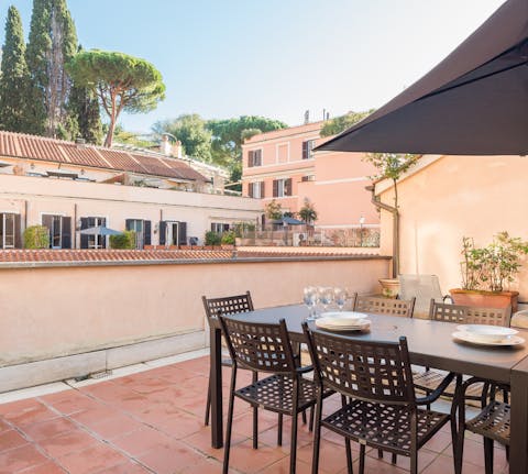 Enjoy breakfast on the wonderful terrace surrounded by pastel buildings