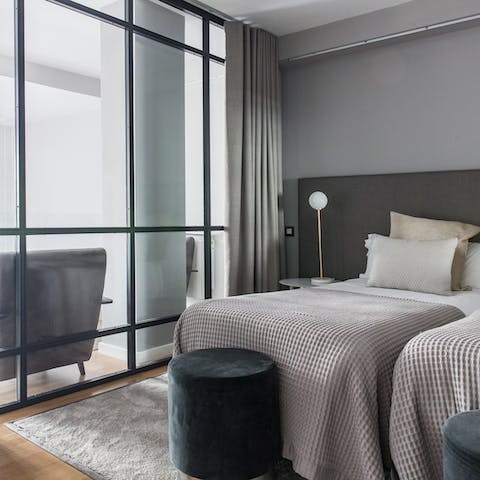 The glass walls in this bedroom