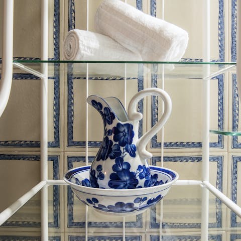 Admire the elegant porcelain tiles in the bathroom