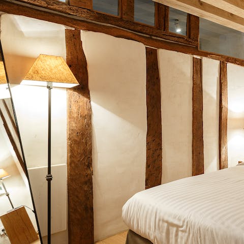 Admire the rustic wooden beams as you drift off to sleep