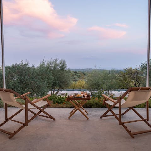Sit back and soak in the expansive views with a drink