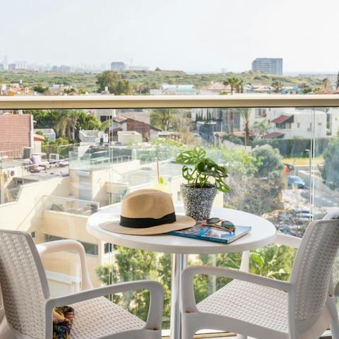 Take in beautiful rooftop views over your morning coffee from the private balcony
