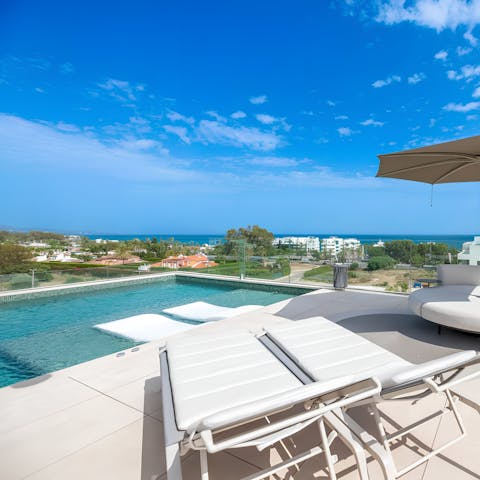 Head to the beach or spend a lazy day by the private rooftop pool