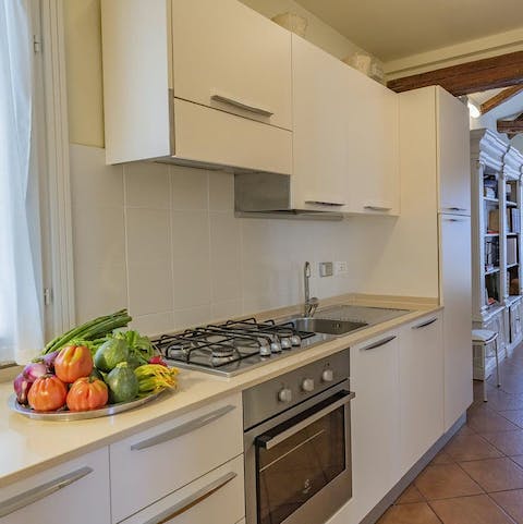 Prepare an Italian pasta dish in the spacious kitchen