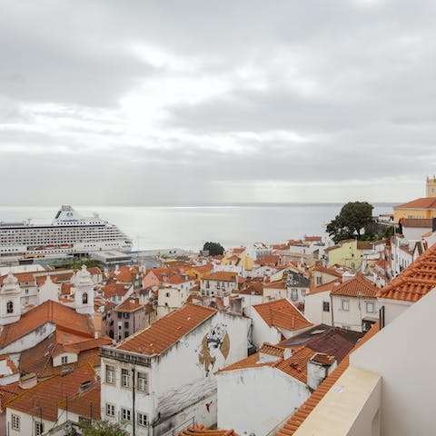 Take a look out at the beautiful view of Alfama