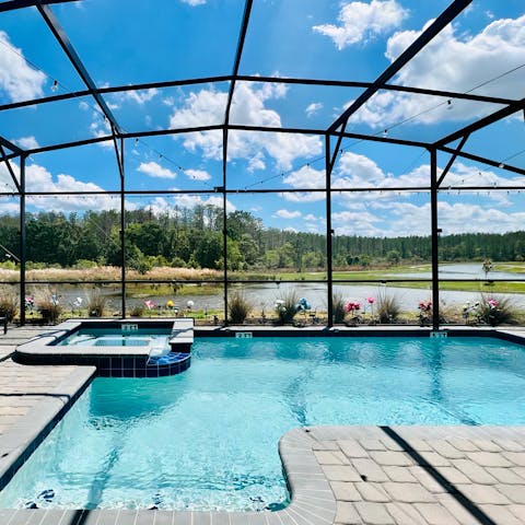 Enjoy lake views from the private pool and hot tub