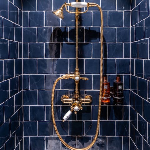 Start the day with a wash in the shower tiled in a regal shade of blue