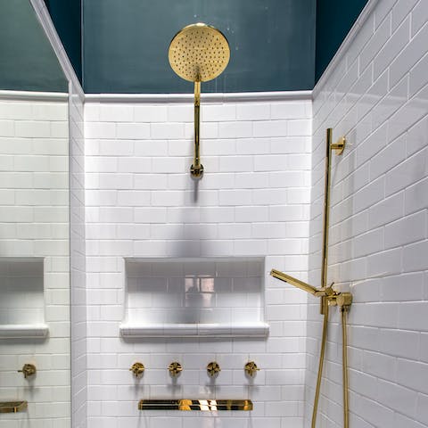 Take a long soak in the shower with elegant brass fittings