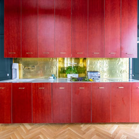 Plate up home-cooking delights in the striking red & gold kitchen