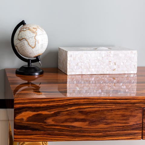 Mother of pearl tissue box on a walnut desk