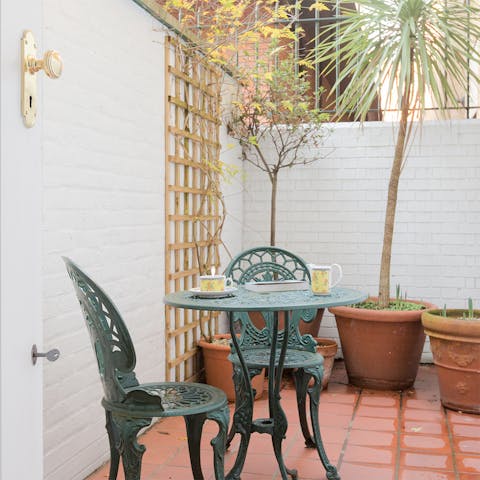 Sip your morning tea outside on the quaint outdoor patio