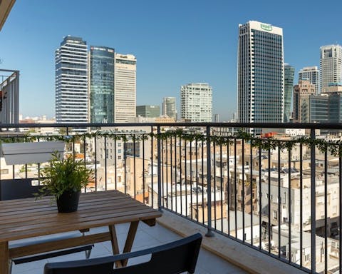 Sip coffee and spot Tel Aviv's landmarks from the apartment's balcony