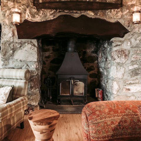 Gather around the stone fireplace after a long day out in the North Walian outdoors