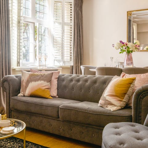 Relax in the elegant living room with a glass of wine after a day of touring the city