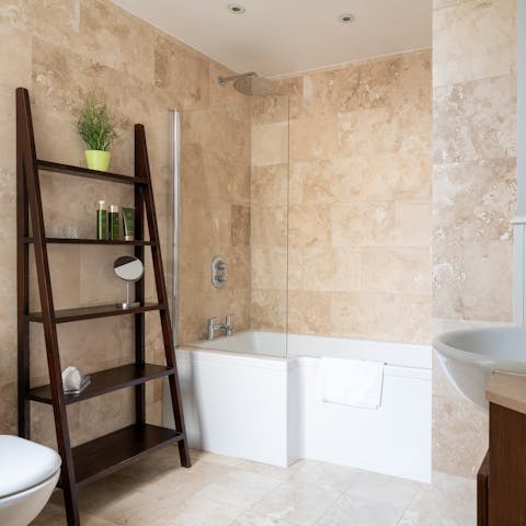 Start mornings with a relaxing soak under the bathrooms' rainfall showers