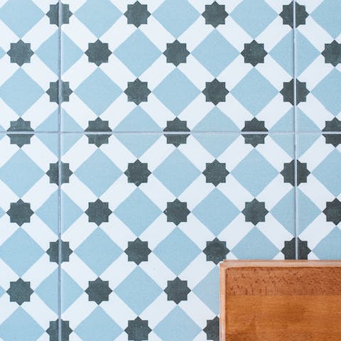 Admire the azulejo patterns in the bathroom