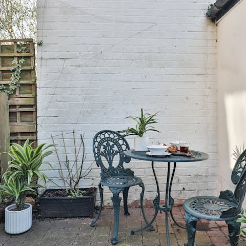 Enjoy breakfast in the pretty patio garden