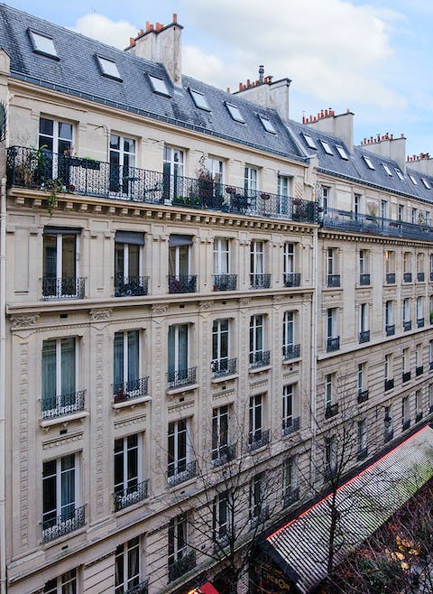 Wake up to stunning views overlooking he Haussmanian buildings on the street below