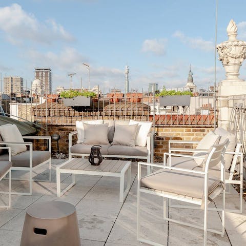 Have afternoon drinks with friends on the terrace, against the bustle of Soho below