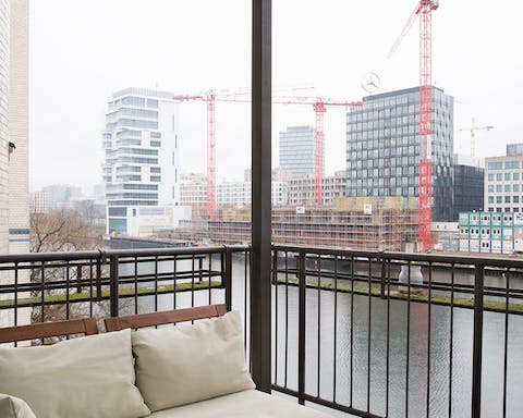Watch the River Spree drift by from your private balcony