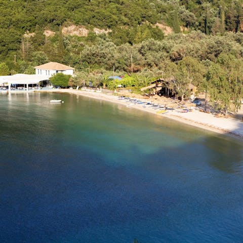 Sink your feet into the turquoise waters at nearby Spilia beach