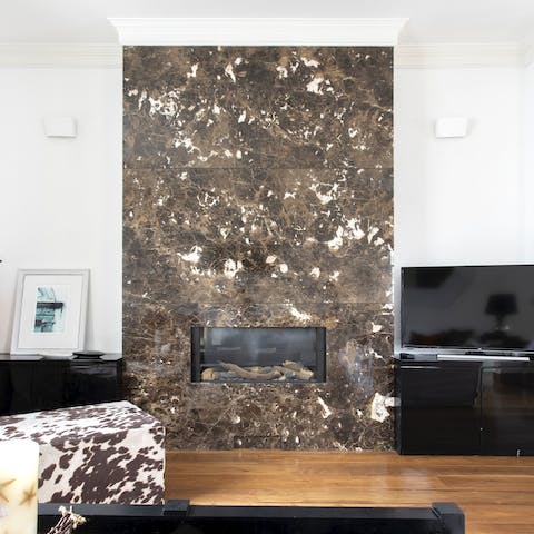 Curl up by the statement marble fireplace on wintery evenings