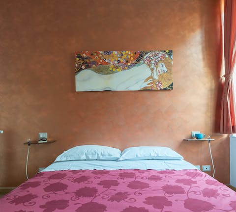 Admire the unique Klimt print in the bedroom