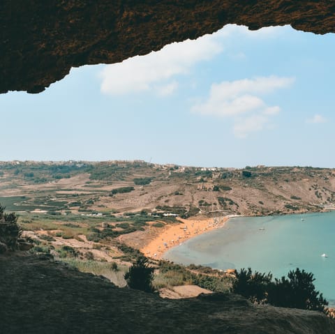 Drive over to Tal-Mixta cave in under fifteen minutes for an incredible view of Ramla Beach