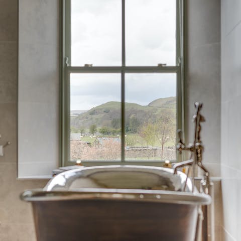 Fill up the copper bathtub and take a long soak while admiring the views