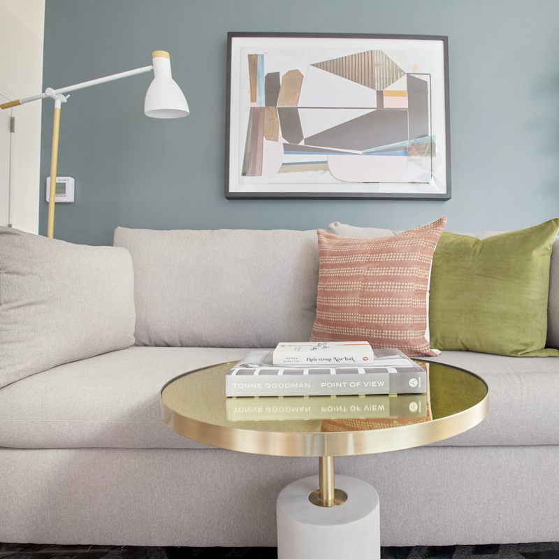 Flick through a coffee table book in the stylish living room