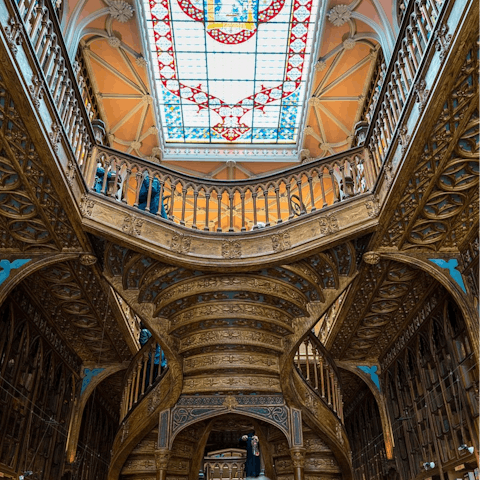 Spend an afternoon getting lost in the famous Livraria Lello, a seven-minute walk away