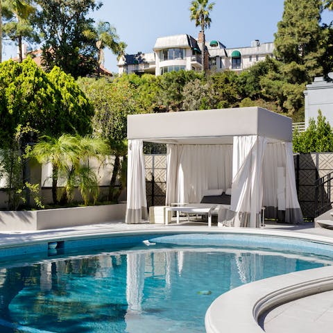 Move between the shade of the cabana and the private pool 