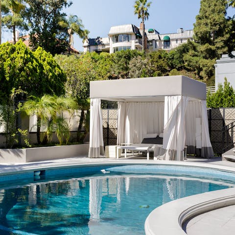 Move between the shade of the cabana and the private pool