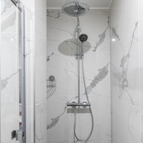 Relax under the rainfall shower after a day of sightseeing