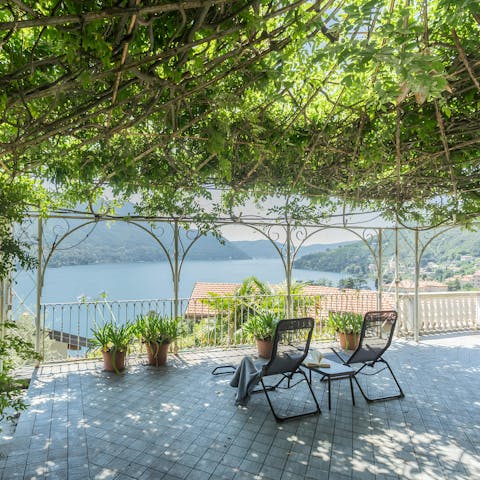 Take in the beautiful lake views from the vine-shaded gazebo